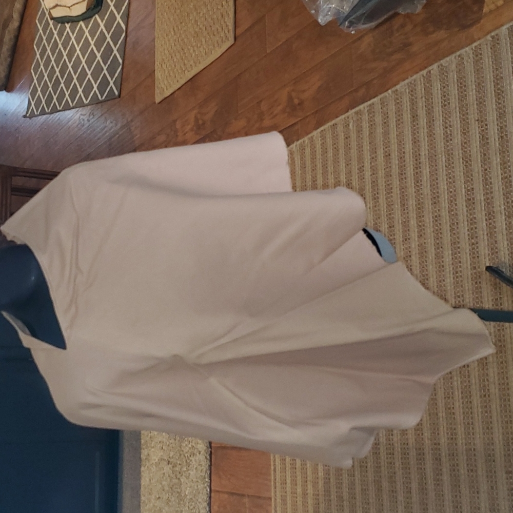 Flannel fleece poncho/wrap in a neutral toast shade.